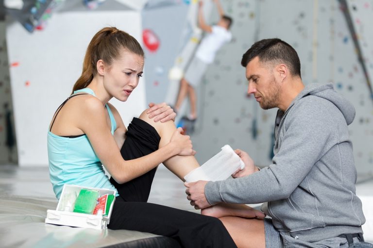 female wall climber with ankle injury